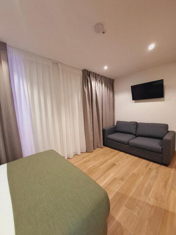 Quadruple Room 1 double bed +1 Sofa Bed with private bathroom